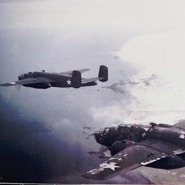 Photo of two B25 airplanes in flight. 