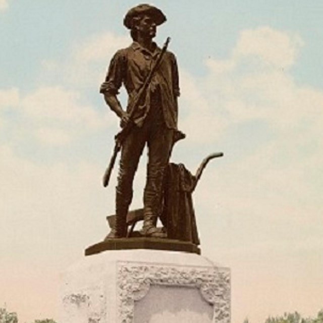 Bronze statue of a soldier with a rifle. 