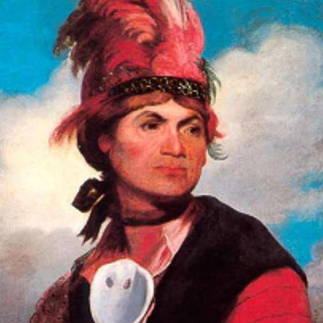 Painting of American Indian in traditional garb. 