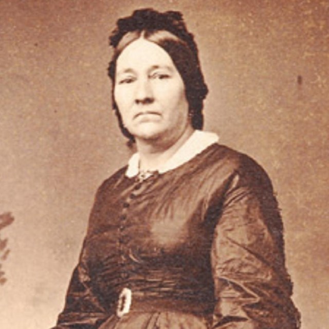 Photograph of Eloisa McLoughlin standing.