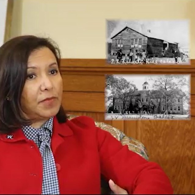 Woman in a red coat speaks with images of a small school and large school imposed in front of her
