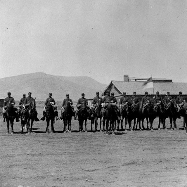 Several african american mounted soldiers in formation