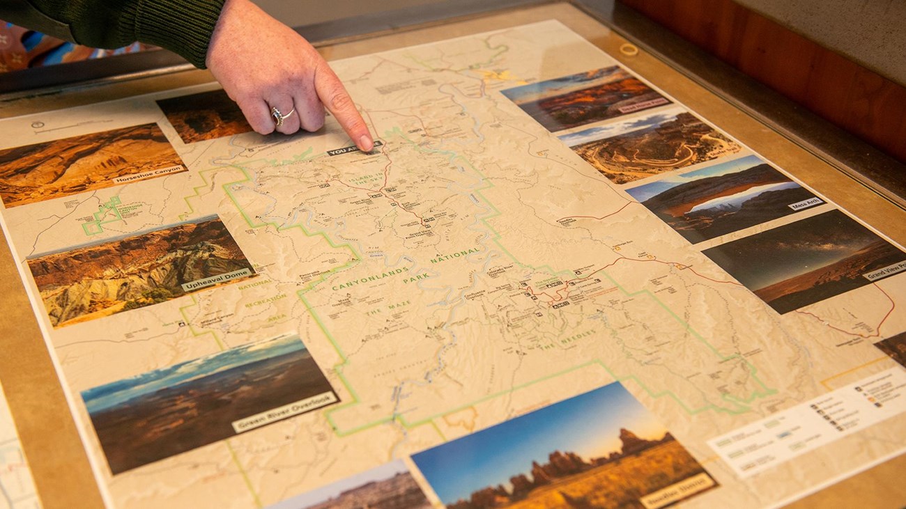 Ranger points to a map of Canyonlands 