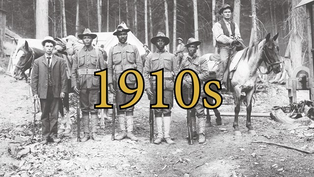 Four African Americans standing shoulder to shoulder in camp from The Big Burn in 1910.