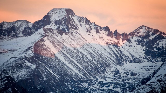 View of mountain peak at sunset.