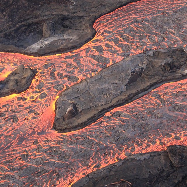 lava flows across black rocks