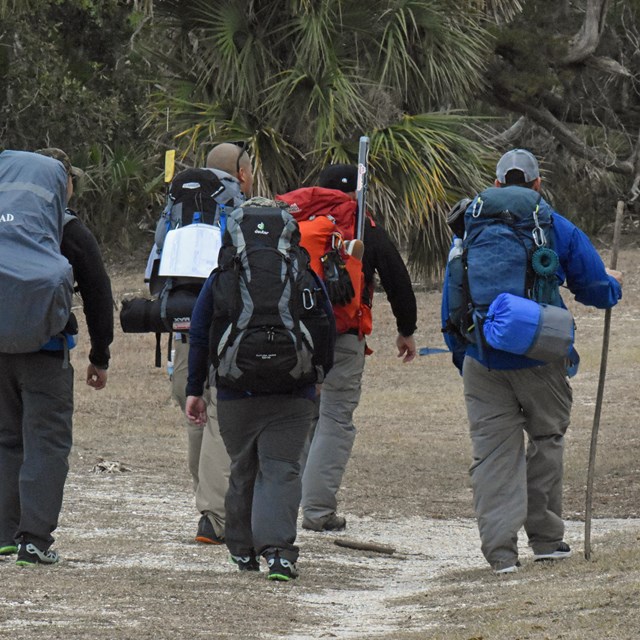 Photo of backpackers hiking on the island 