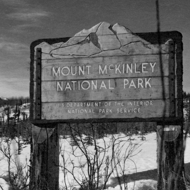 a historic photo of the entrance sign for Mt. McKinley National Park