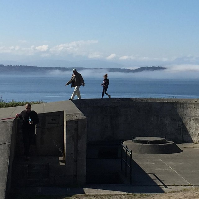 a family explores the military battlements at Fort Casey
