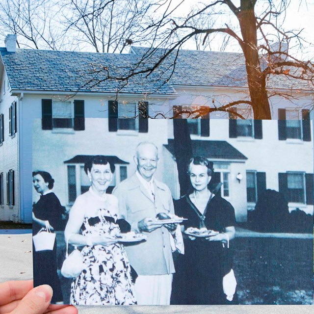 Old Photo of Ike and Mamie being held up by a volunteer inline with the Eisenhower house now.