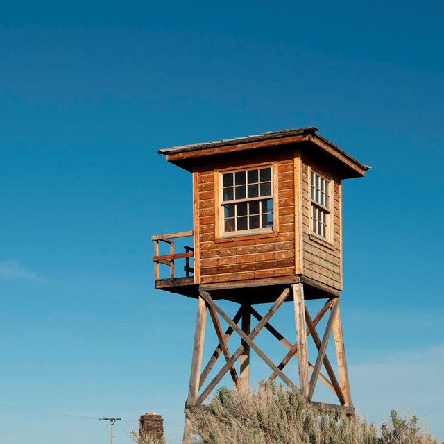 Wooden guard tower on stilts.