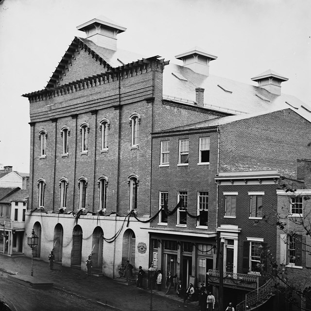1865 photo of Ford's Theatre draped with mourning crepe