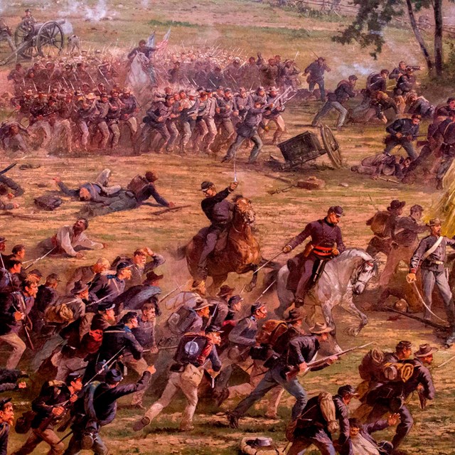 A scene from the Cyclorama painting depicting two Union officers on horseback leading their troops.