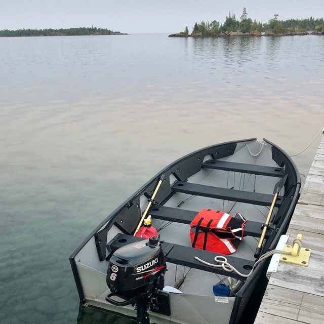 Boat tied to a dock.