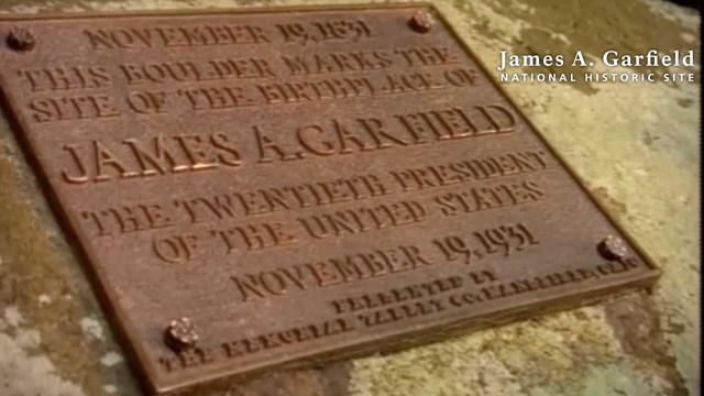 A bronze plaque mounted on a boulder signifying the birthplace of James A. Garfield