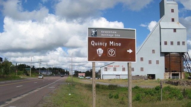A sign indicating the location of the Quincy Mine Keweenaw Heritage Site