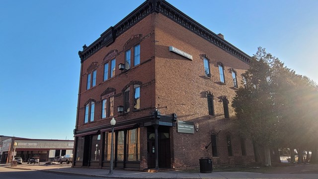 A view of a tall brick building, now serving as the Calumet Visitor Center.