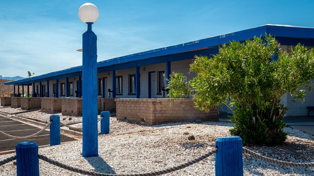 View of white and blue motel.