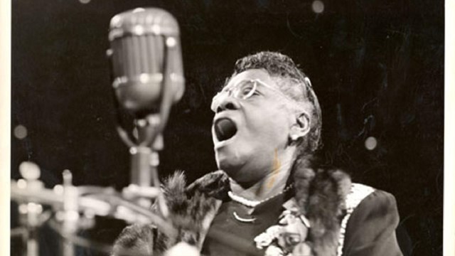 Bethune speaks into a microphone