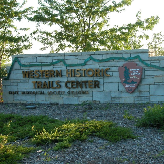 A stone entry sign for the Western Historic Trails Center.