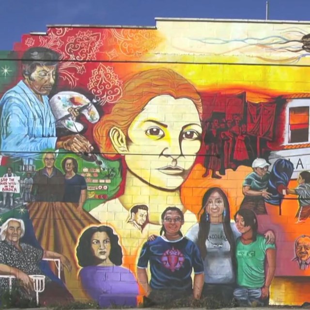 Colorful mural San Antonio's Westside neighborhood depicting Latinx residential history.