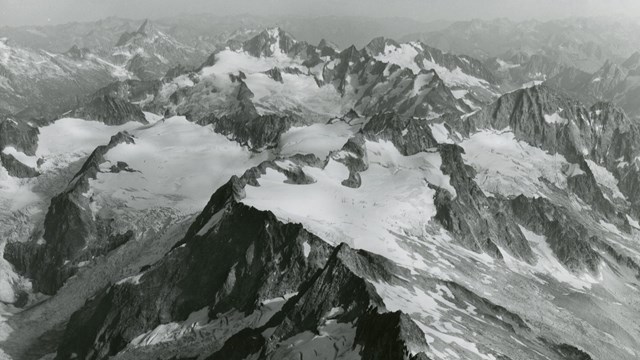 black and white photo of a mountainous ridge 