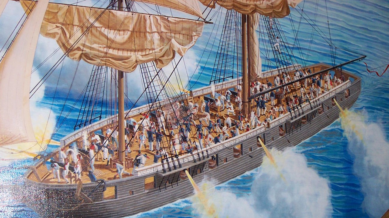 The isolated image of a ship from a brightly painted mural, firing cannons from both sides