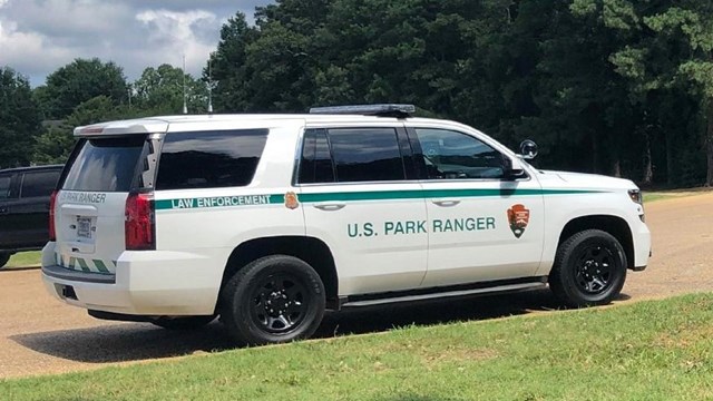 An image of a green and white National Park Service Law Enforcement vehicle