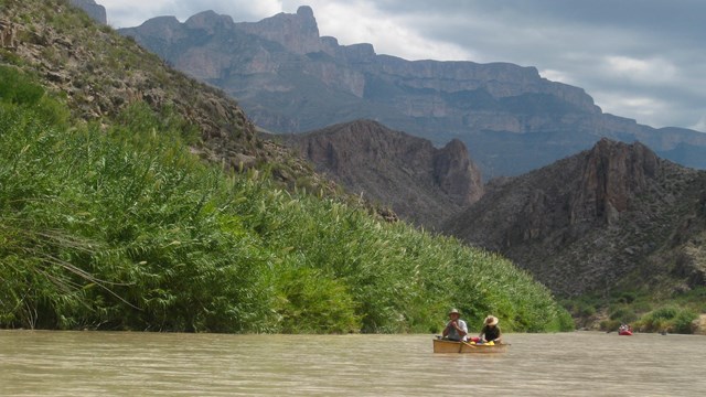 Canoers paddling through Boquillas Canyon