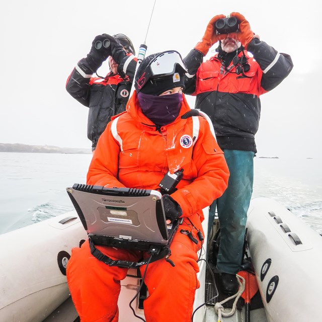 Researchers on a boat in coastal Alaska.