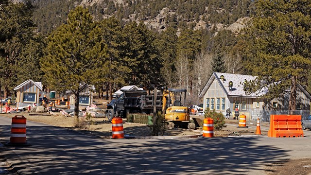 The Fall River Entrance to RMNP is under construction. Orange cones line the lane to the kiosk.