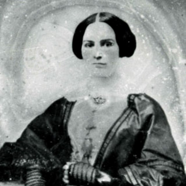 Black and White photo of a woman in 19th century clothing