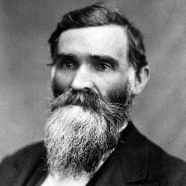 Black and white photo of a beardedman