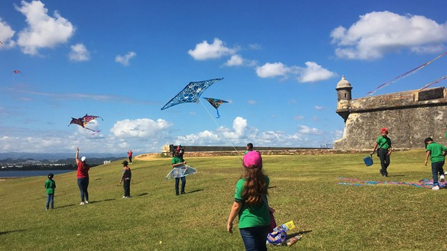 Children flying kites at El Morro