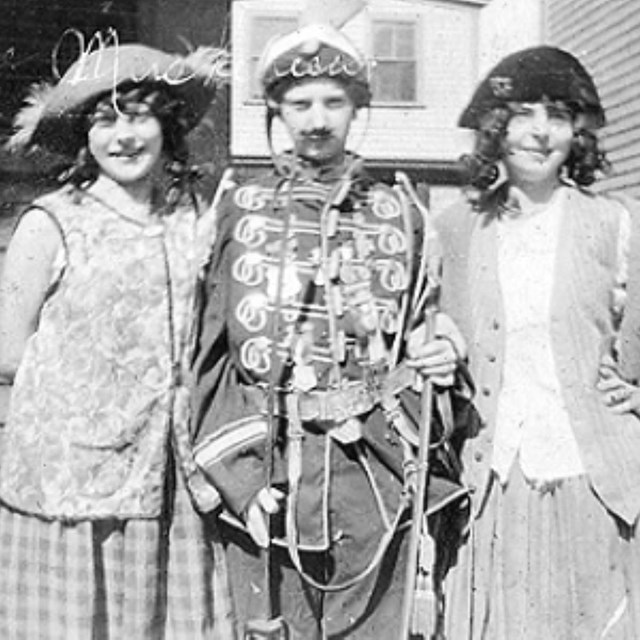 Black and white photo of three girls dressed in pirate costumes.
