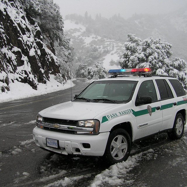A patrol vehicle parked on a snowy road