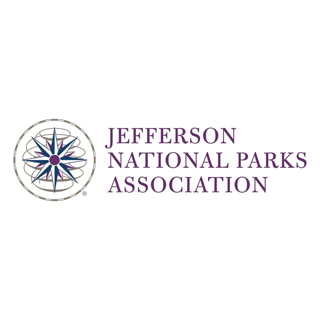 A compass next to purple text of Jefferson National Parks Association on a white background