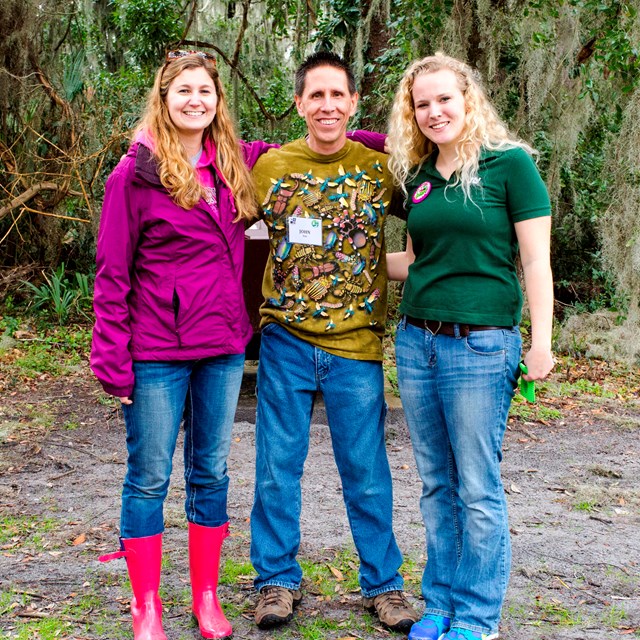 three people in forest