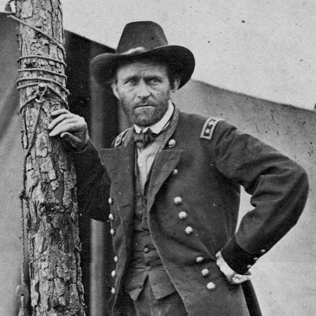 U.S. Grant in U.S. Army uniform and leaning on a tree in 1864. 