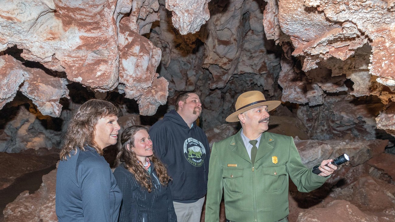 A ranger shows visitors Wind Cave