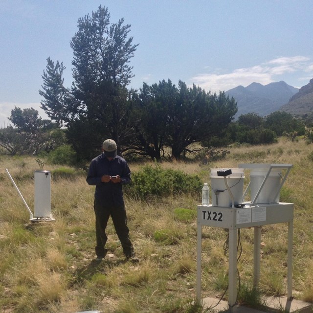 Scientist working on weather station