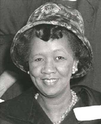 B&amp;W photo of Ms. Height wearing a hat and black suit