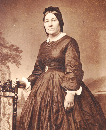 Photograph of Eloisa McLoughlin wearing a dark dress.