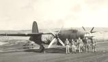 John Pletcher and his crew, October 28, 1942 at Adak, Alaska on the ramp parking area.