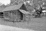 Black and white photo of un-whitewashed carpenter shop