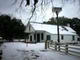 View of the Magnolia Plantation Store during the February snowfall.