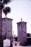 The city gates c. 1975 undergoing preservation maintenance by NPS.