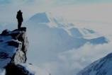 Climber looking over to Mt. Foraker from 17,200-feet on Denali