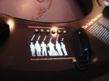 Telephone headset that allows visitors to listen to interpretive display