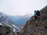 Stephen Dobert standing on rock near False Summit looking south toward Skagway, Alaska.